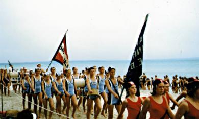Junior team Parkdale Life Saving Club marching at a beach carnival [picture].