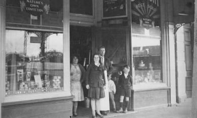 Robins Store shopfront with Robins family members [picture].