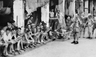 Batavia Java, 1945. A group of Australian and British Troops until recently Prisoners of War. The Australians in this group are members of ‘Black Force’ [Picture].