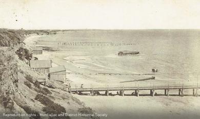 Mentone Beach, Seagull Rock and piles of Old Baths in distance, c1920 [picture].