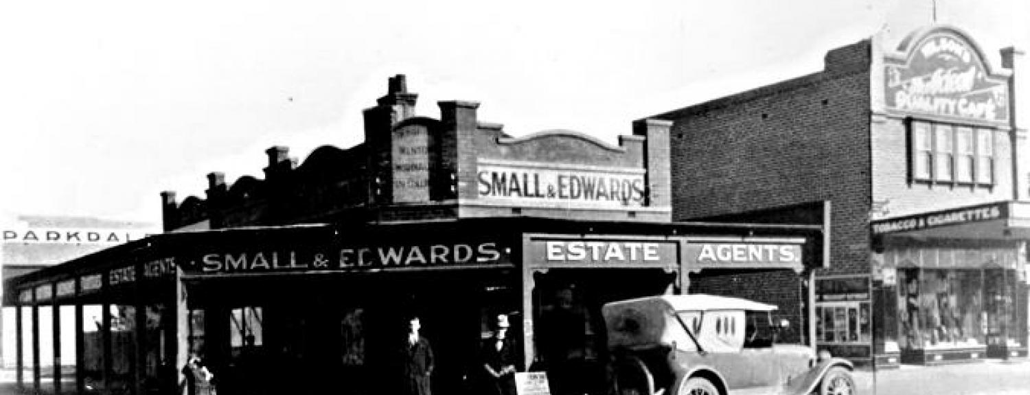 Small & Edwards Estate Agents on Como Parade Parkdale with Norman Thomas on the left and Geoff Connard, c1930 [picture].