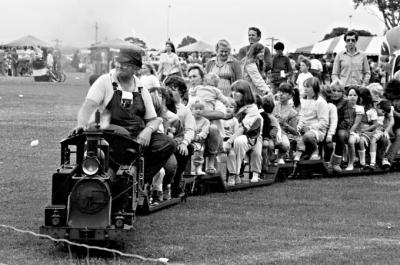 Children riding on the miniature train at the Parkdale oval on Mayor's Day 1985 [picture].