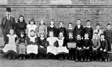 Class V group at Cheltenham State School, John Allnutt second from the right in the front row [picture].