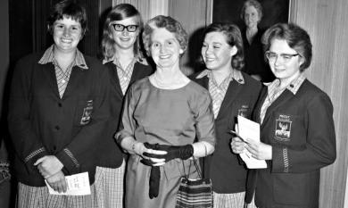 Principal of Mentone Girls' Secondary College, Miss Nina Carr, with four senior students at the school speech night.  From left Sue Fleming, Judy Blundell, Judy Dixon and Helen Isaacson [picture].