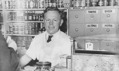 Frank Robins working in the store [picture].