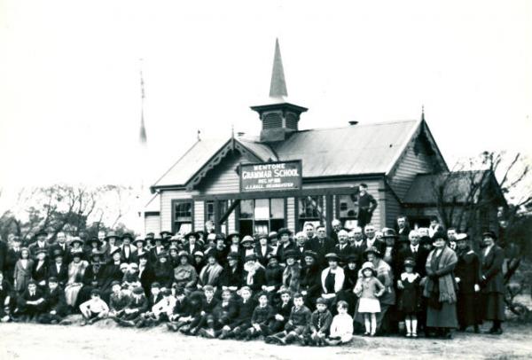 Mentone Grammar school students, teachers and parents outside the building originally erected at McCristal's Mentone College, the forerunner of St.Bede's College [picture].