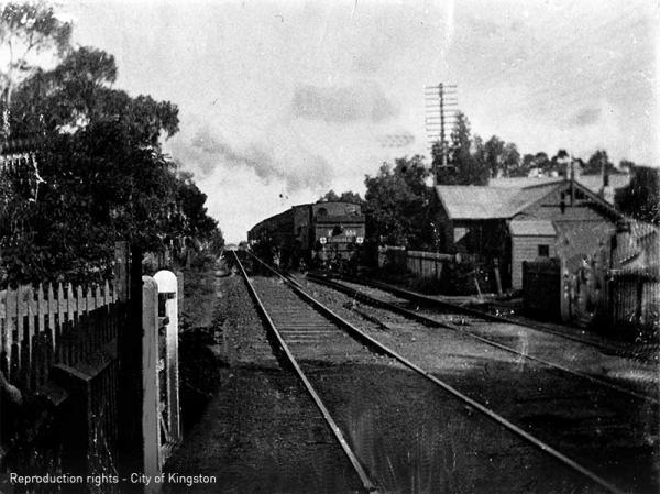Steam Train from Mentone at Cheltenham just before Charman Road Crossing, Gate Keeper’s Cottage to right [picture].