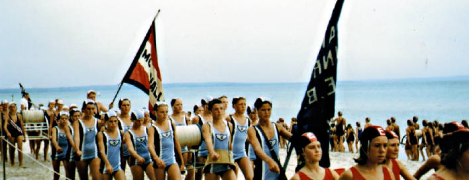 Junior team Parkdale Life Saving Club marching at a beach carnival [picture].